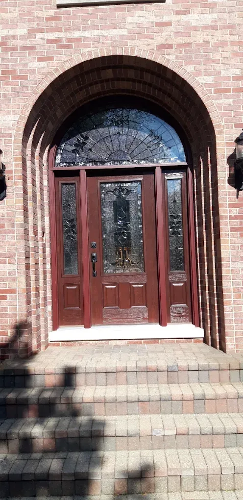 Arched wood entry door selected by an Elmhurst, Illinois homeowner and installed by Durabuilt