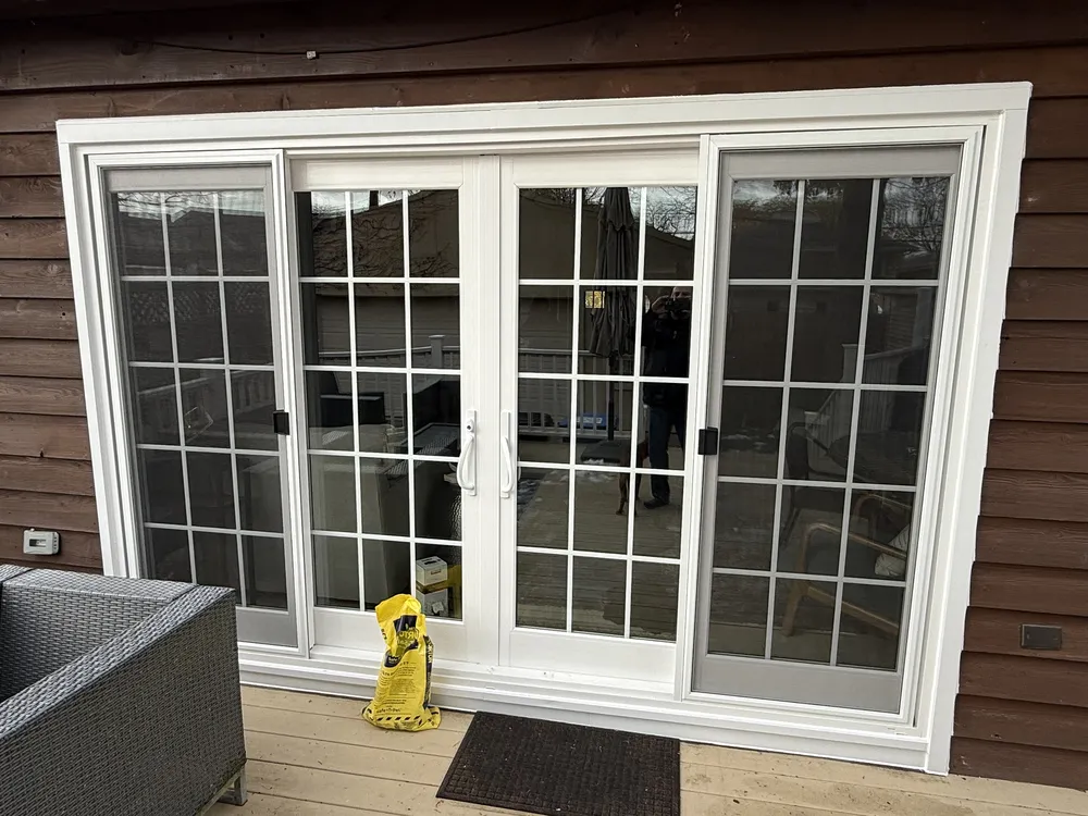 New white sliding patio doors opening onto a rear deck in Elmhurst, Illinois