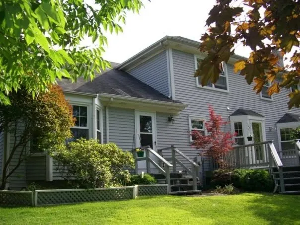 Durabuilt crew installation of new siding on the rear deck exterior of an Elmhurst, Illinois home